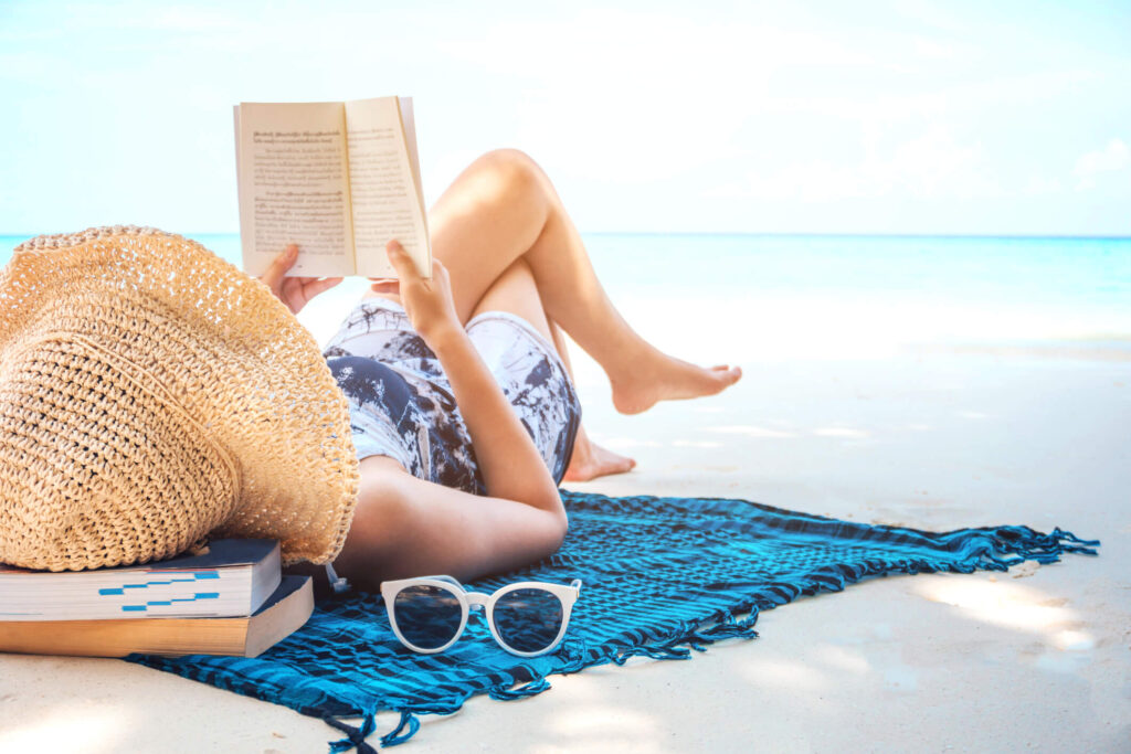 Landlord relaxing on the beach because they trust a Phoenix property manager with their rental property.