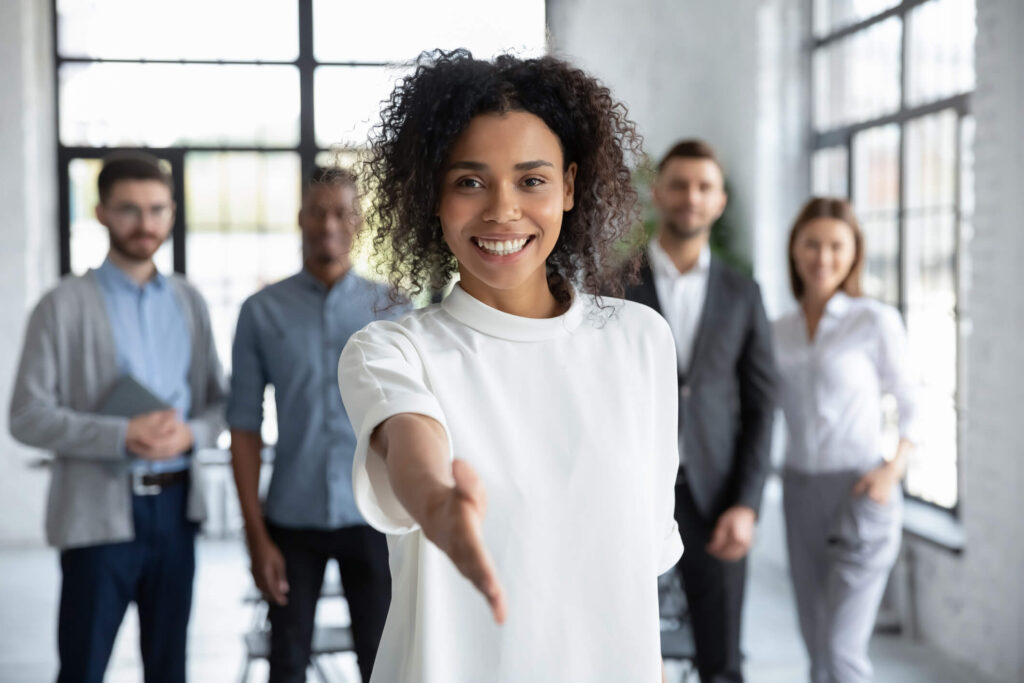 Phoenix property management professional extends her hand to shake.